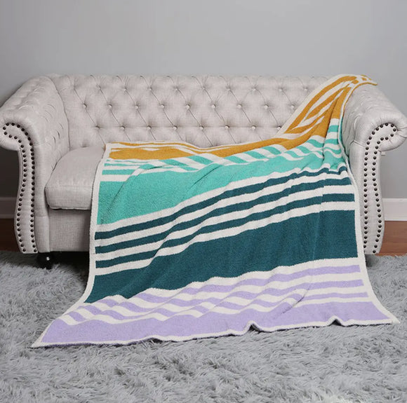 Green and purple striped blanket