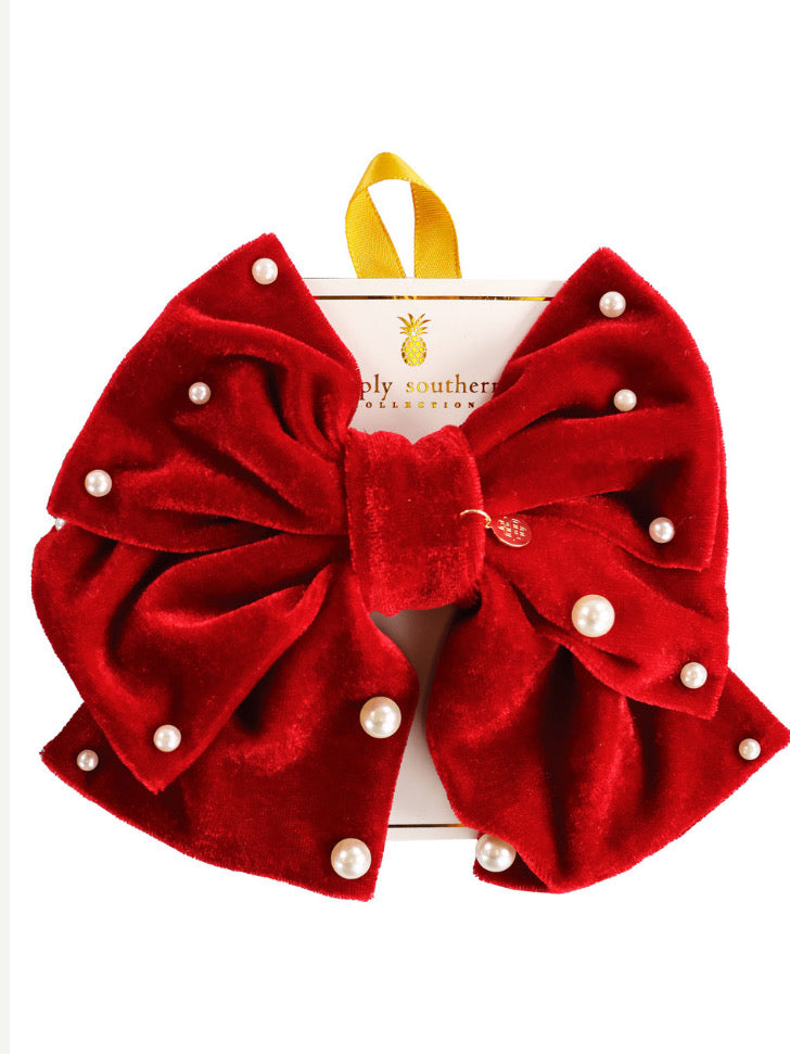 Red velvet bow with pearls