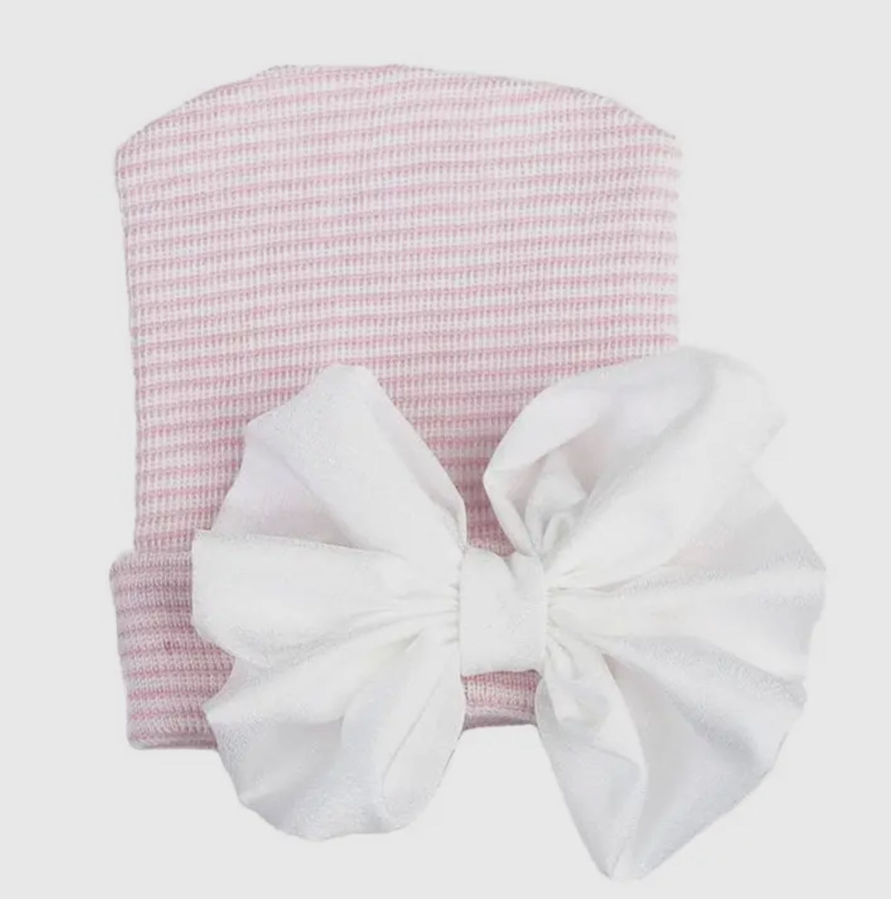 Pink and white newborn hat with bow